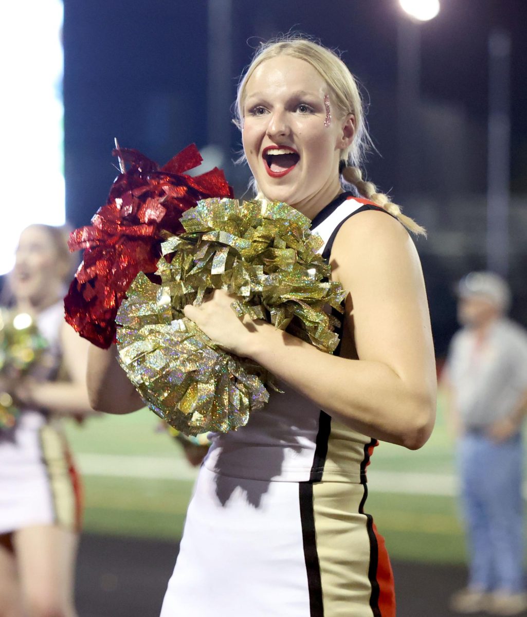 Senior Kaylee Davis cheers on during the football game against Galena Park on Friday, Sep. 1, 2023. The Football team brought home a win of 27-7 and the cheer team hyped them up the whole game. “We were very excited and very proud of our boys and our team for coming together to win,” Davis said. “Whenever we got the first touchdown of the game everyone on the cheer team was so excited and it brought the team closer.”

