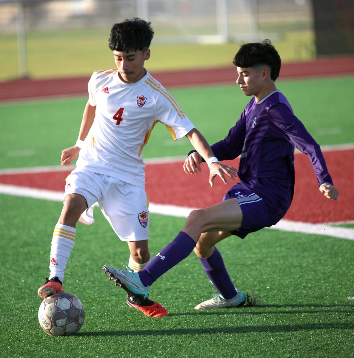 ALL MINE. Sophomore Brandon Velazquez defends the ball while trying to find a way to make a pass to his teammates on Friday, Jan. 12, 2024. The junior varsity team won the match 4-0.
