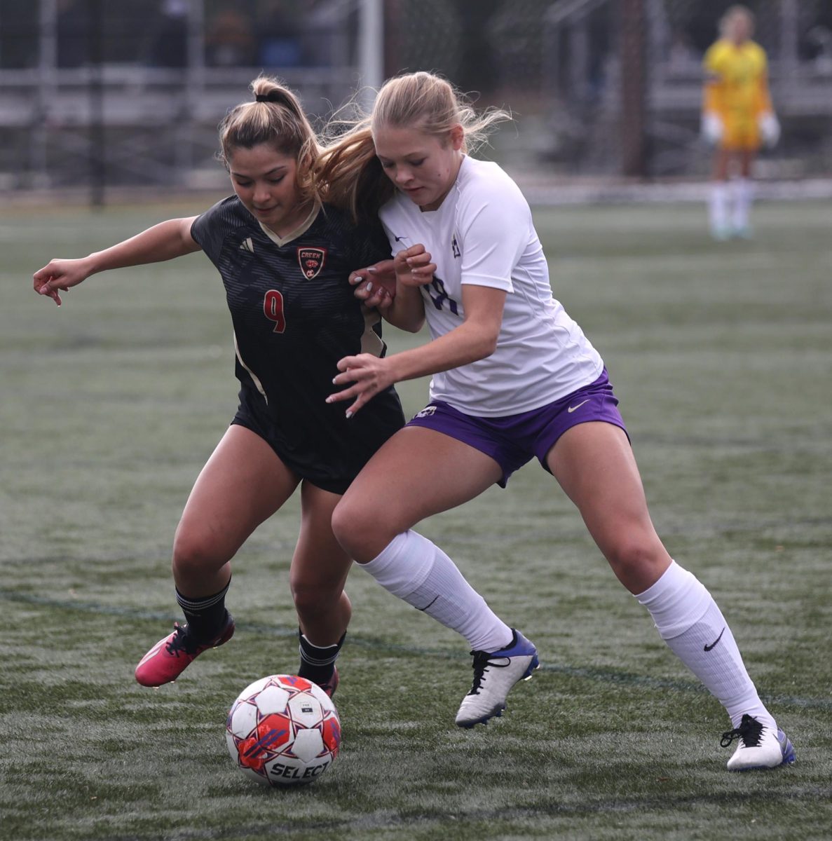 GET IT. Junior Giselle Benitez pushes the other player away from the ball on Friday, Jan. 5, 2024. Benitez plays the attacker and midfielder positions. “The game was very intense and I like how everybody was not just standing around and was staying motivated,” Benitez said. 

