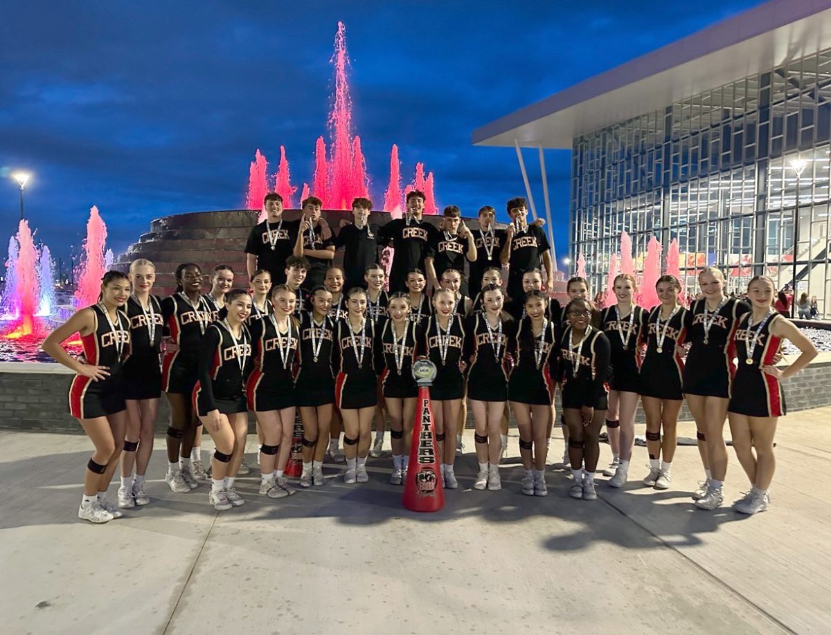 The varsity Co-Ed Cheer team poses for a group photo after their first place win in UCA Regionals on Sunday Nov. 5, 2023. 
