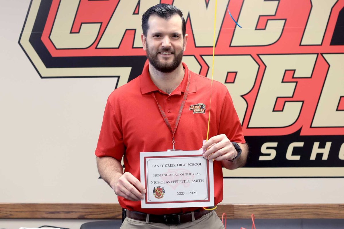 Instructional Technologist Nick Eppinette-Smith on Friday, Feb. 23 after being named the 2023-2024 Rising Star for Caney Creek High School.