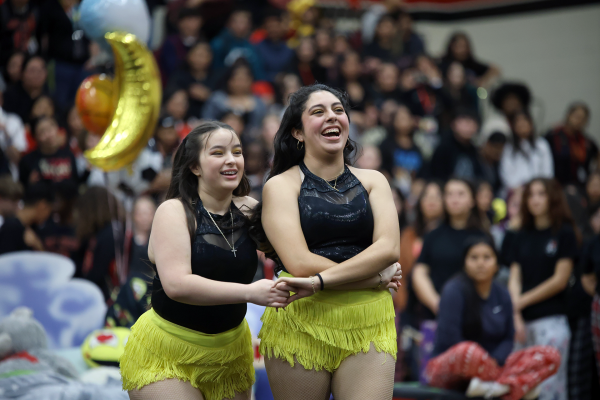 FUEGO. Junior Esperanza Villanueva and Sophomore Jacqueline Arteaga dance as pairs to their routine during the slumber pep rally on Friday, Jan. 3, 2024. It was the first time the Pantera en Fuego dance team performed at a pep rally. “I felt nervous and anxious about it at first but then I started to notice that people were happy so I felt awesome,” Villanueva said, “I would definitely do it again if I could.”