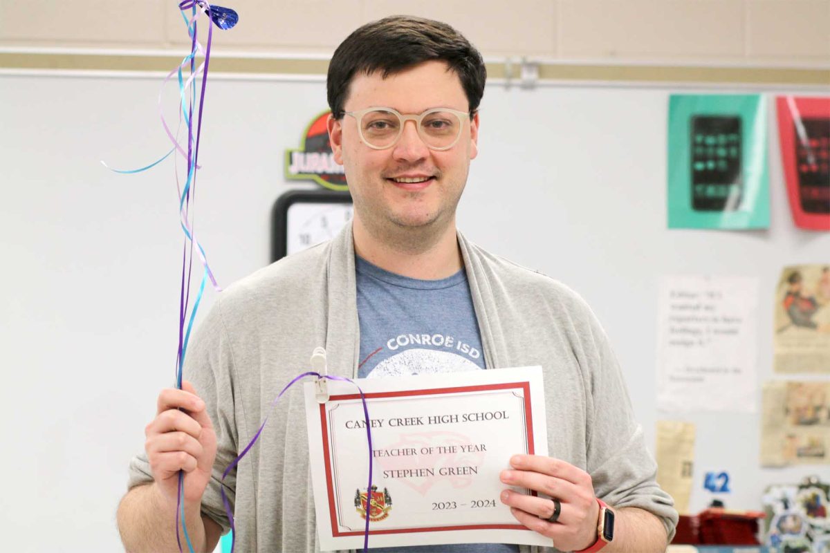 Journalism teacher Stephen Green on Friday, Feb. 23 after being named the 2023-2024 Teacher of the Year for Caney Creek High School.