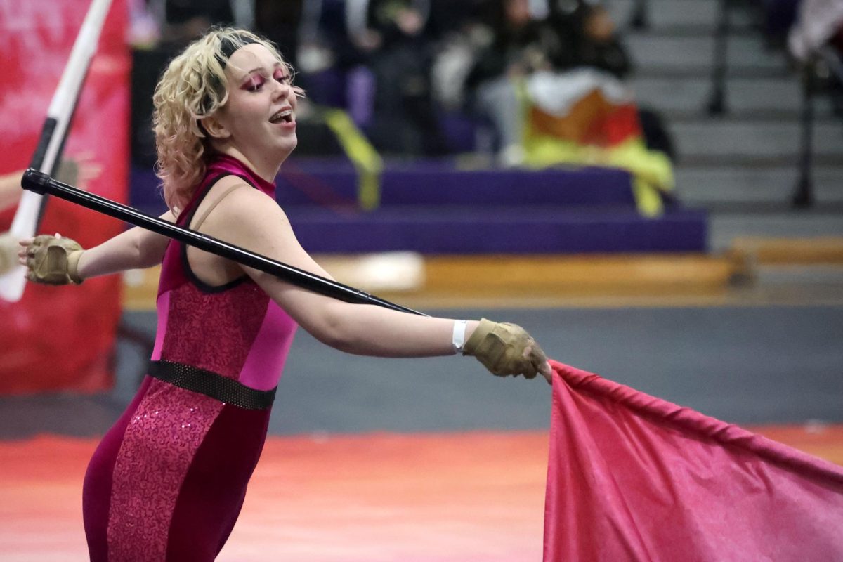 Junior Angelina Cantrell dances with her flag on Saturday, Feb. 17, 2024 for a Color Guard competition at Willis. Junior varisty and varisty teams both places 1st in their second meet.