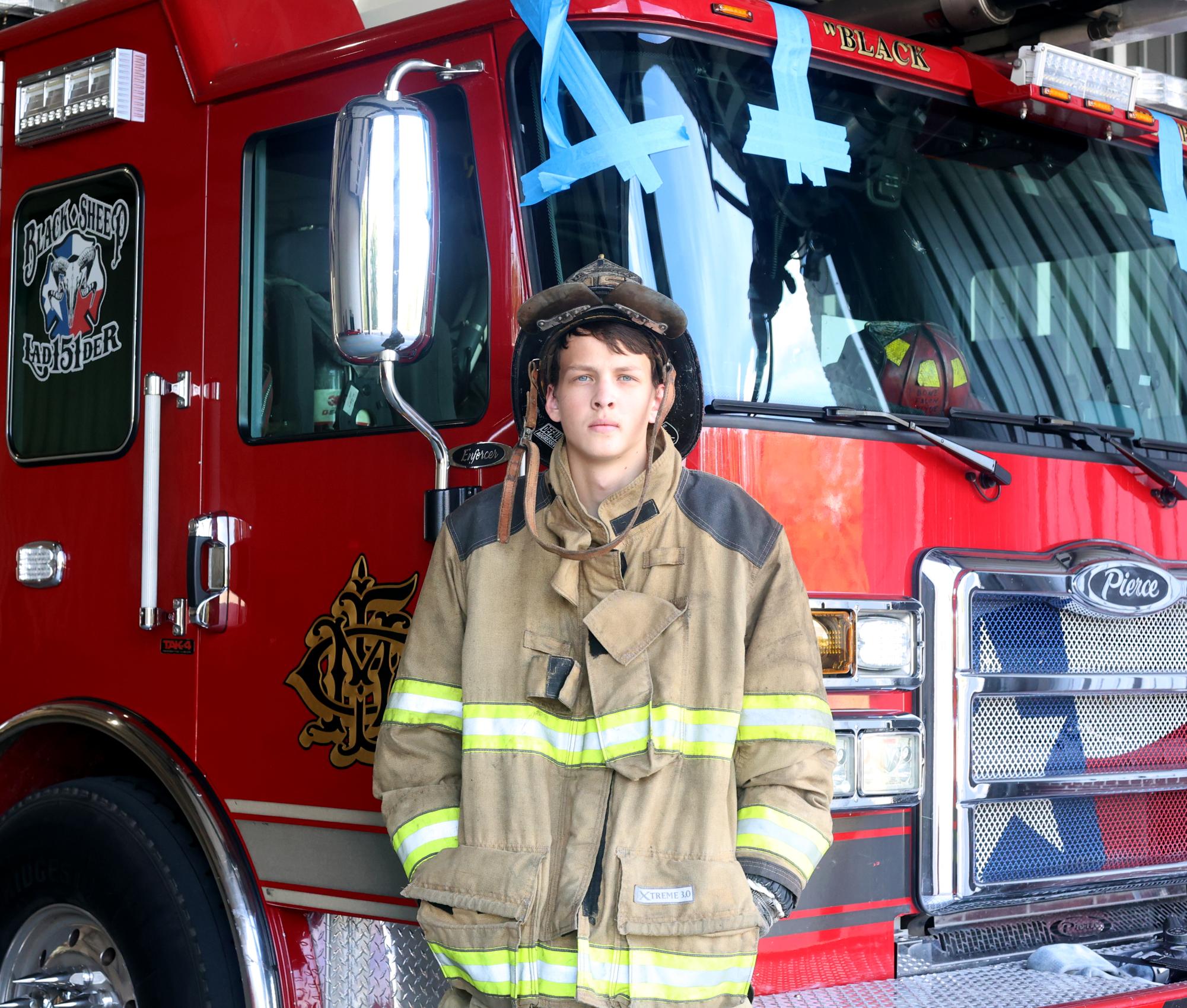ROOKIE. Senior Bryan Pagett poses in front of New Caney Fire Station 151 with his uniform on Sunday, Oct. 22. Padgett is a volunteer firefighter two days a week, either after school or on weekends. “It’s been a fun experience so far,” Padgett said. “I can’t wait to graduate so I can go to the fire academy.”

