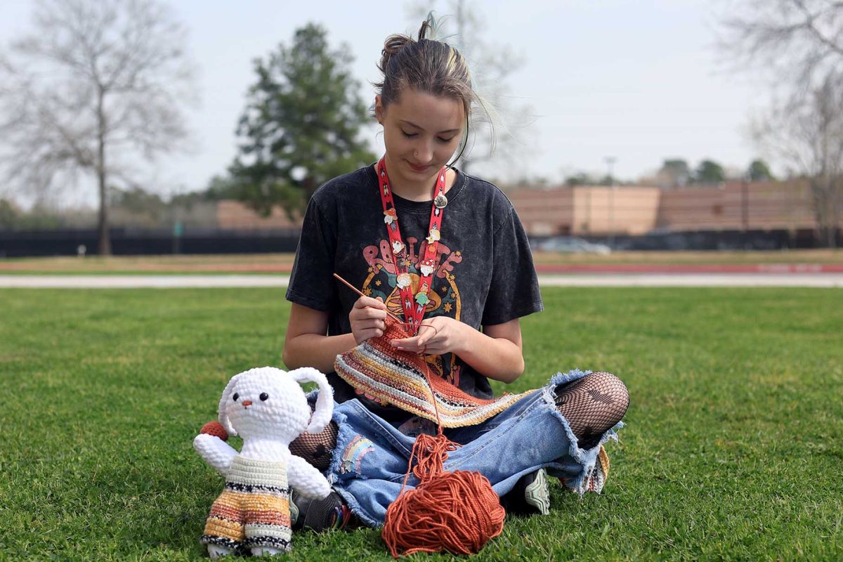 ALANI AND I. Freshman Samantha Fullen sits down while she works on a crochet top on Wednesday, Feb. 28, 2024. Fullen has been working on top for herself, which is a matching piece with her crochet bunny, Alani.
