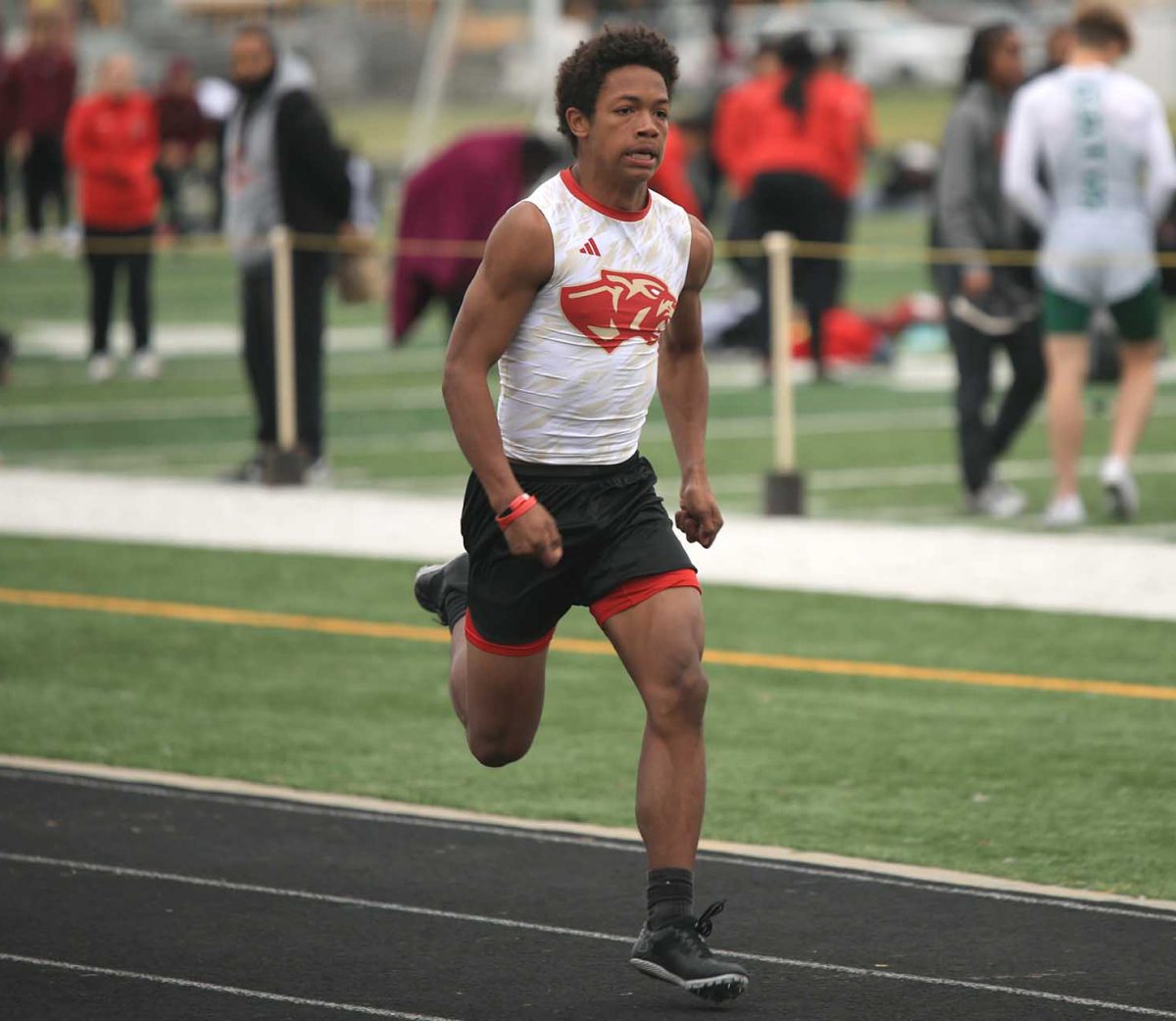 ALMOST THERE. Sophomore Jahamante Haden Kuhn sprints down the track during a meet on Thursday, Feb. 29, 2024. “The relay race went pretty good, our time dropped by about a second. I was scared going into it,” Kuhn said. “I ended up catching some people so it went pretty well.”
