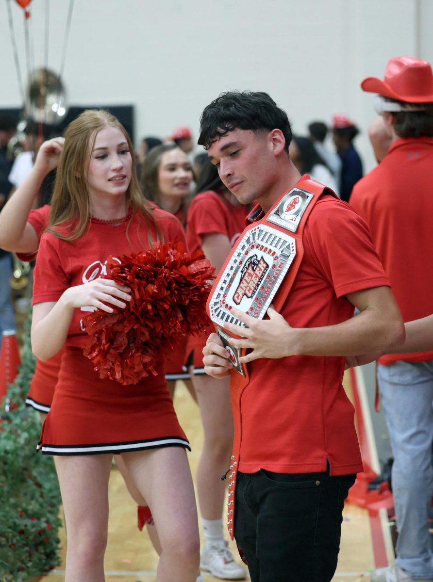 Junior Roger Gauvreau poses with the belt like he won the WWE after the Junior classes won the battle of classes on Sept. 27. Gauvreau was excited from winning with his class because whenever he would go to past pep rallies Gauvreau and his classmates wouldn't win. 
