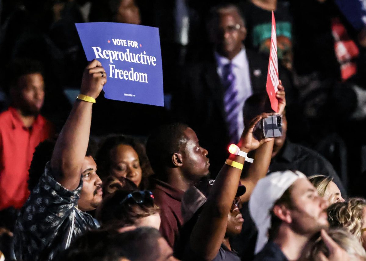 FREEDOM. Kamala Harris supporter holds a sign stating “Reproductive Freedom”  in the midst of the audience at the Houston rally in NRG Stadium on Oct. 25. The rally offered signs to all audience members near the entrance of the stadium, many of which took.