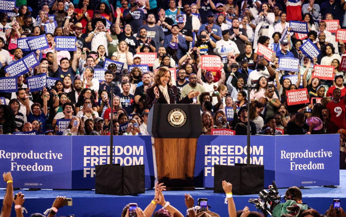 APPLAUD APPLAUD. Vice President Kamala Harris applauds at the podium of the Houston rally at NRG Stadium on Oct. 25. The audience greeted Harris with loud cheers and applause, in response, Harris applauded them.