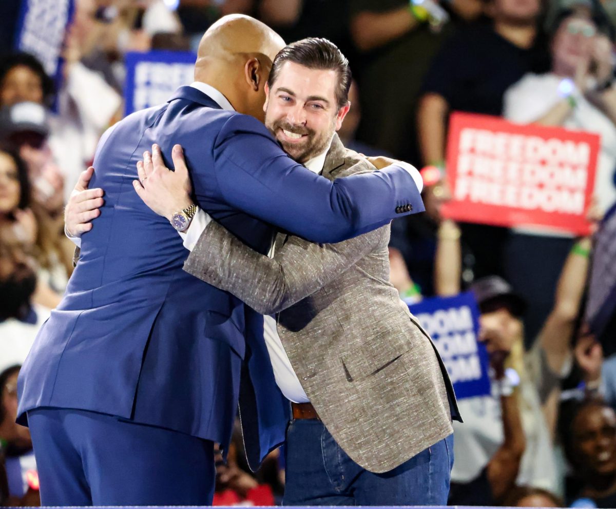 EMBRACE CHANGE. U.S. Representative Colin Allred hugs speaker Josh Swarovski after making his entrance at the Kamala Harris rally held in NRG Stadium on Oct. 25. Allred was introduced and endorsed by Swarovski for Texas Senator.