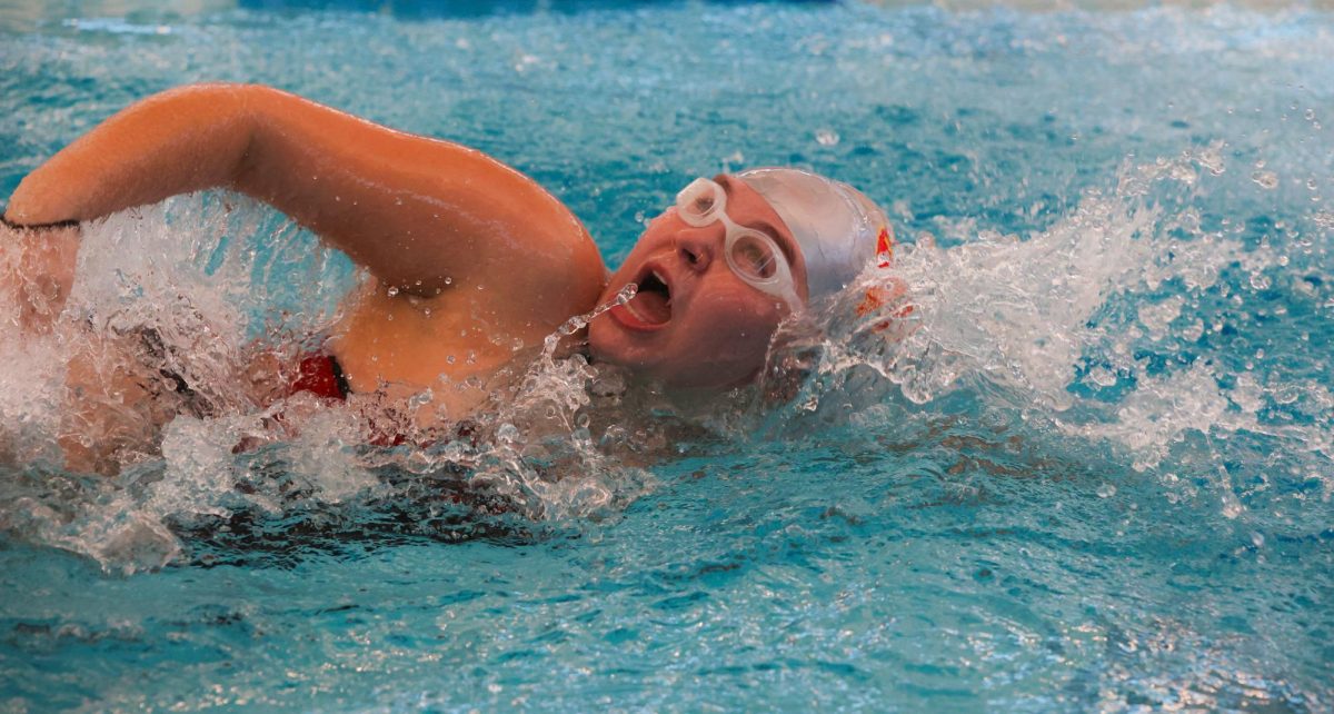 WATCH OUT. Junior Mayah Roop swimming freestyle at the New Caney Invitational on December 6th, 2024. Mayah was seen celebrating with her team later that night.