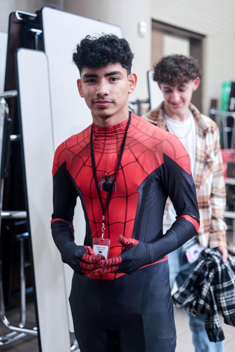 FIT. Sophomore Emil Pineda wears a spiderman costume that he found at the winter thrift store held by STUCO on Dec. 12.
