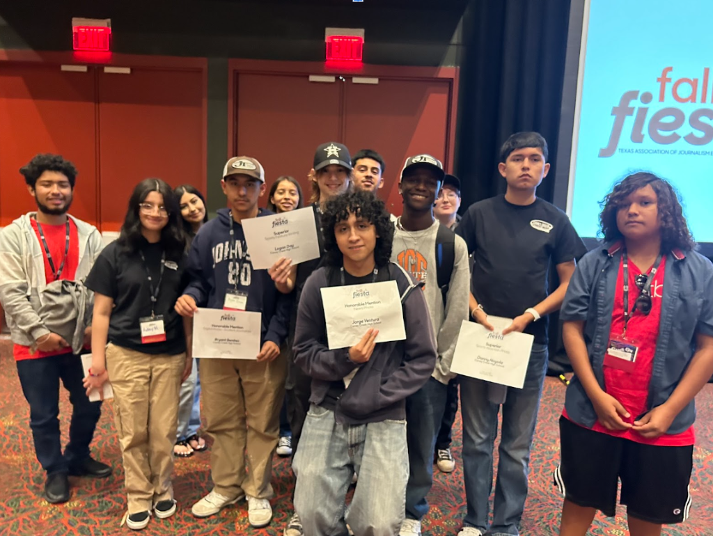 Caney Creek Student Media member pose together holding their award certificates at the ATPI fall fiesta journalism convention on Oct. 14. Behind the scenes of the creek compass, all members of student media contribute to its publications.