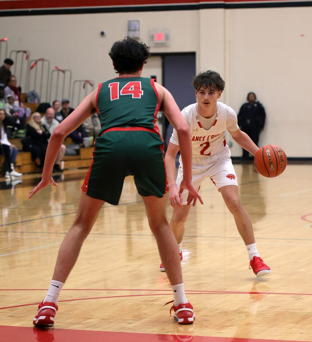 THINKING. Sophomore Rayden Peroni is thinking about how he is going to get past his opponent against The Woodlands on Tuesday, Dec.  3, 2024.