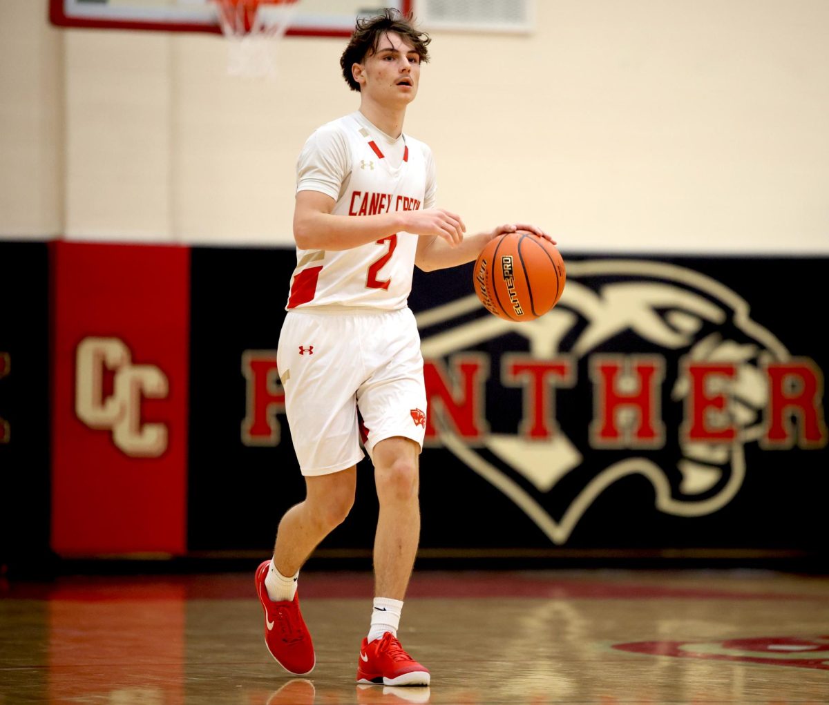 FOCUSED. Sophomore Rayden Peroni scans the area to find an open teammate to pass the ball to against The Woodlands High School on Tuesday, Dec. 3, 2024.