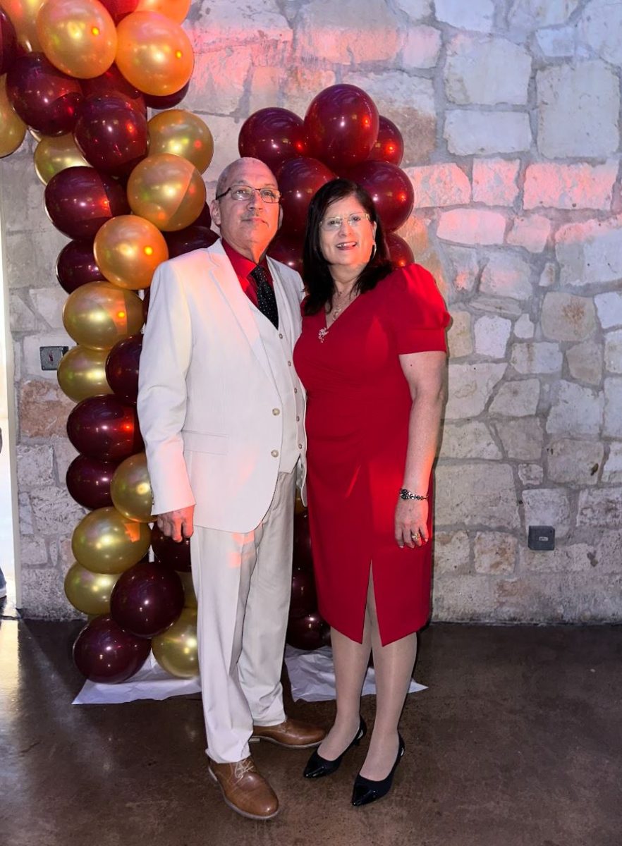 Rene Hinojosa posed next to his wife Loren Hinojosa.