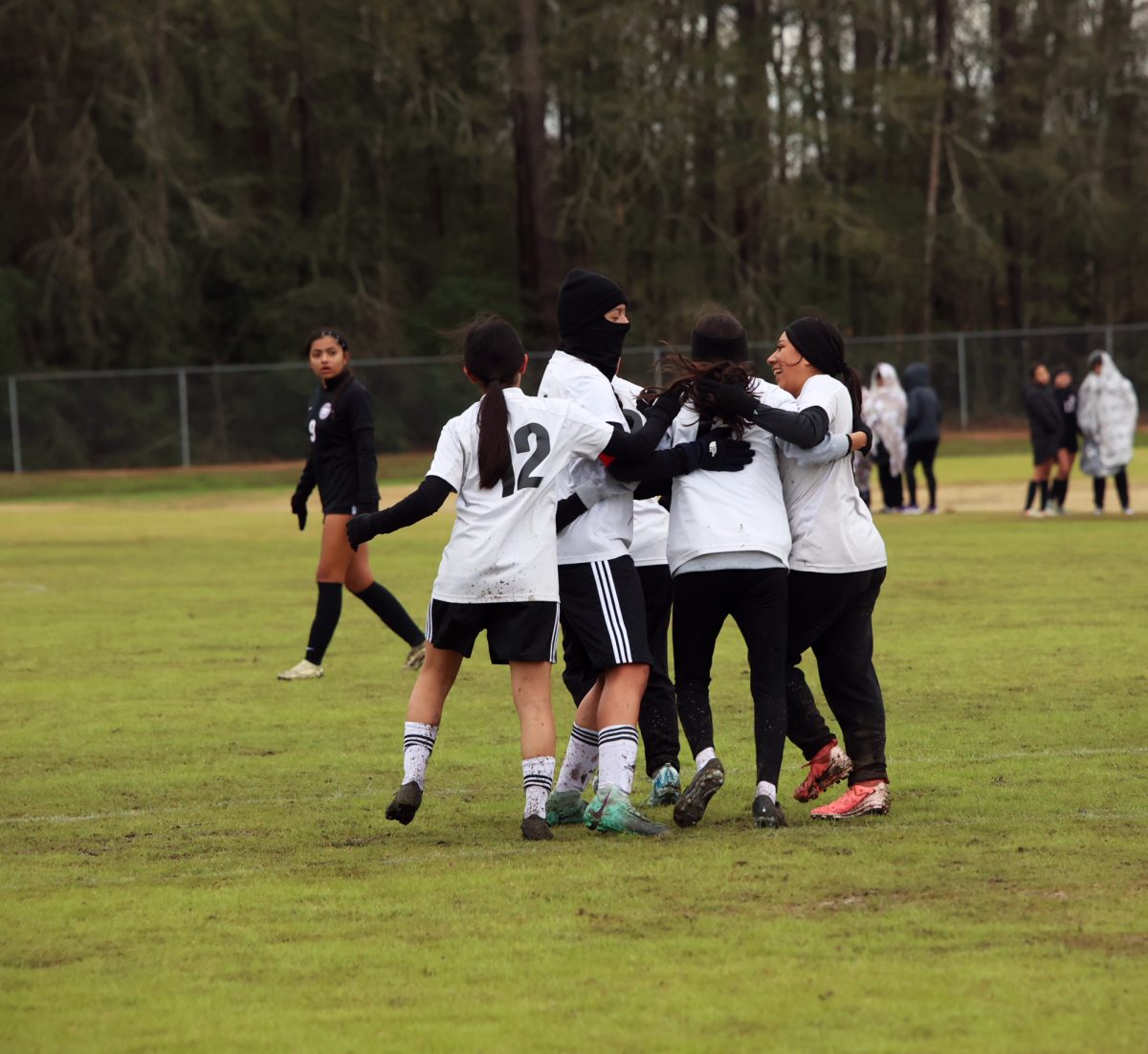 CHEERFUL. Freshman Fernanda Nanjera and her teammates celebrate after scoring a penalty against Humble Friday Jan. 10, 2025.
