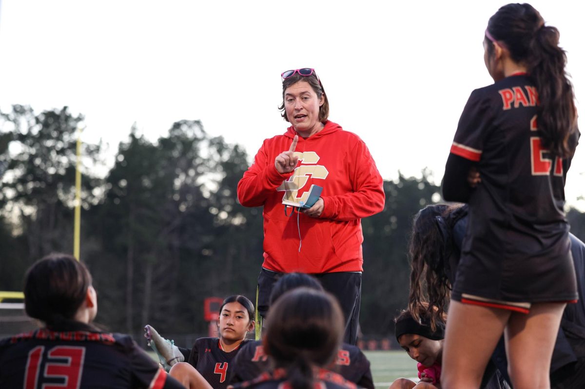 PEP TALK. Varsity girls soccer head coach Gretchen Kloes talking to her team during halftime on Saturday’s game against Clear Falls High School on Jan. 11, 2025.