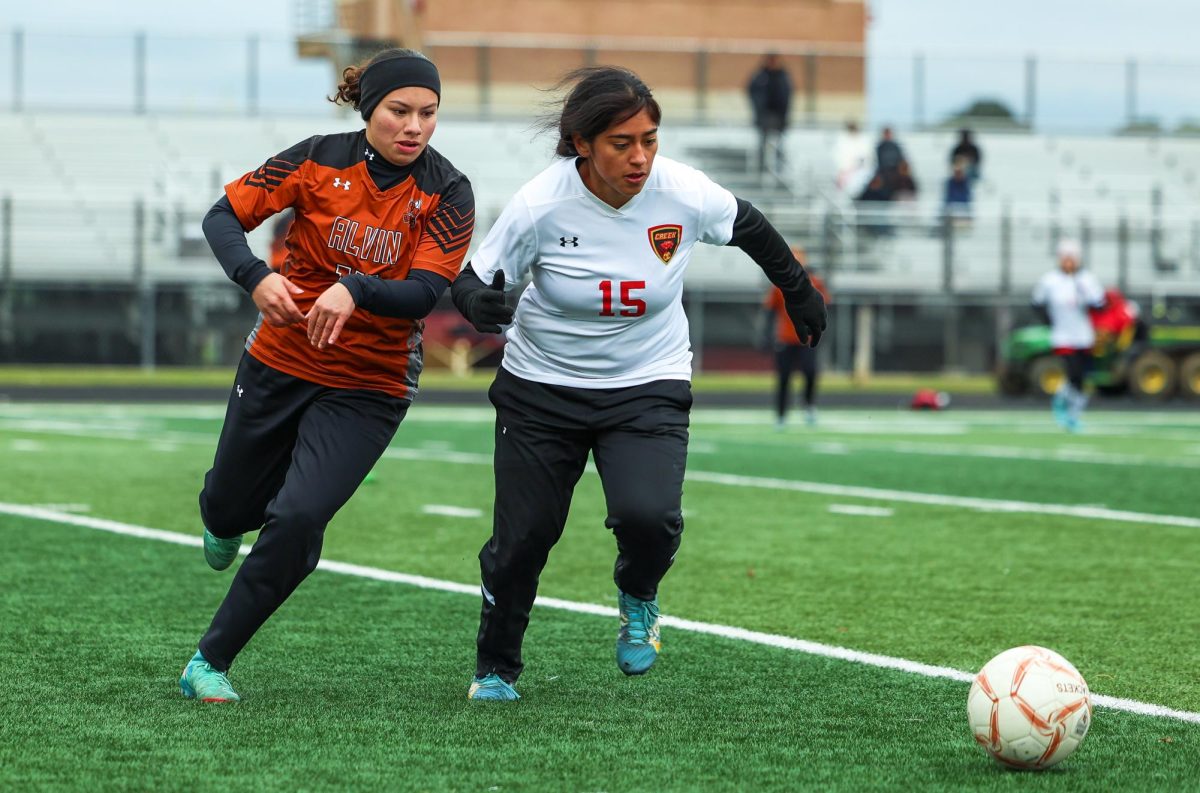 FIGHTING FOR POSSESSION. Freshman Rebecca De Los Santos running towards the ball while the opposing player is, at Friday's game on Jan. 10, 2025.