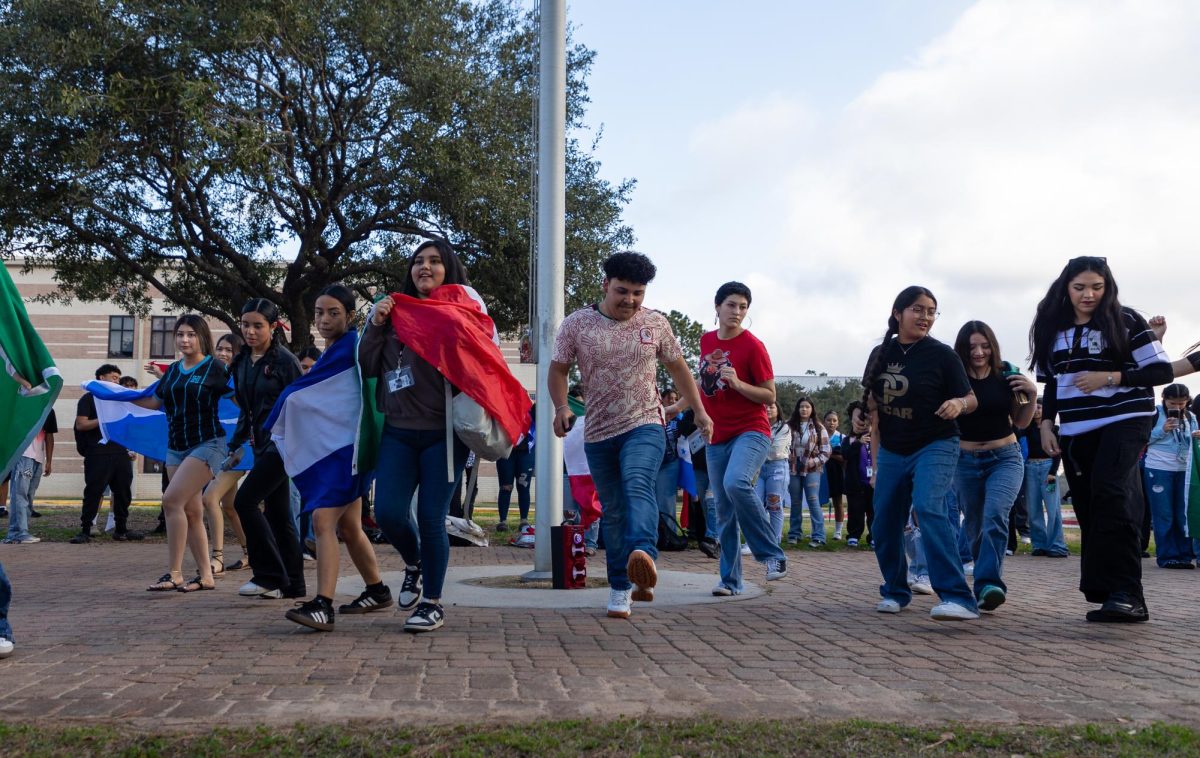 DANCE WITH US. Protestors started line dancing in front of school to show part of their culture Tuesday, Feb. 4, 2025.