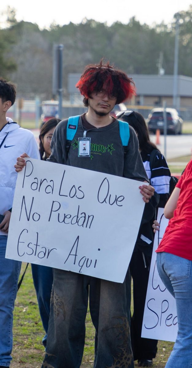 FOR THEM. Adam Vilchik holds a sign during the protest Tuesday, Feb. 4, 2025, that, in Spanish, said, “For those that can’t be here."