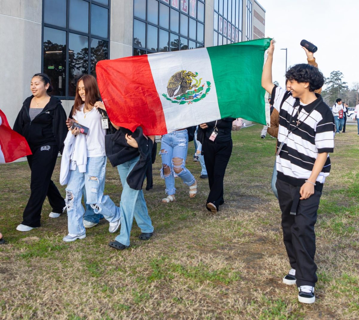 TAKE PRIDE. Students show off the Mexican flag during a protest that took place on school grounds Tuesday, Feb. 4, 2025.