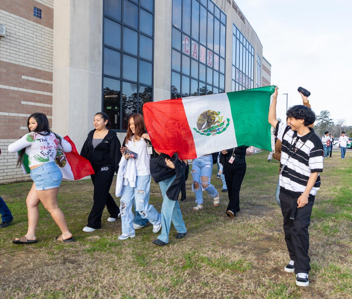 TAKE PRIDE. Students show off the Mexican flag during a protest that took place on school grounds on Feb. 04, 2025.