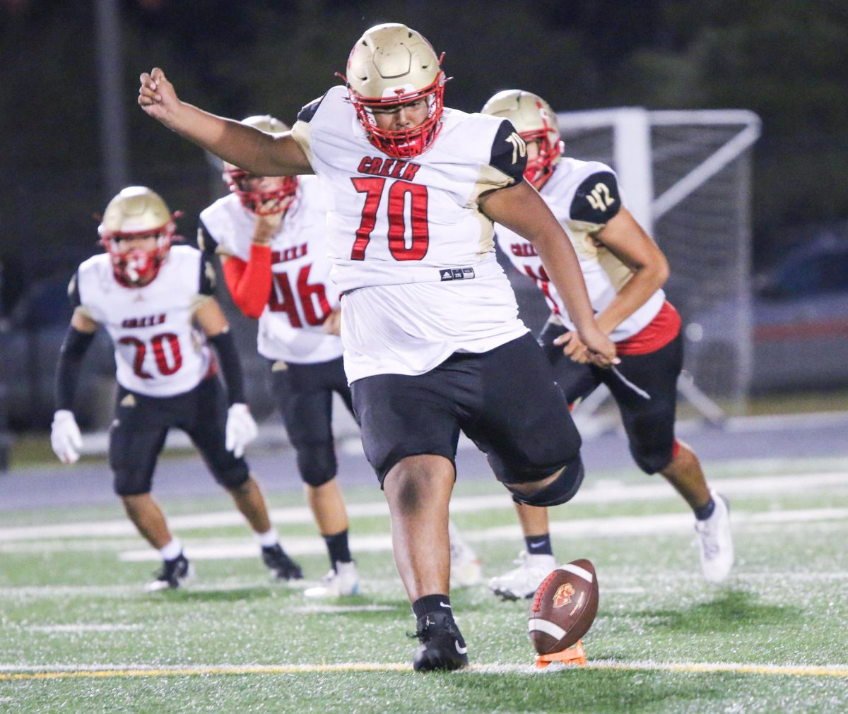 Sophomore Juan Moreira winds his legs back during a kick off during the game against College Park High School Oct. 10.