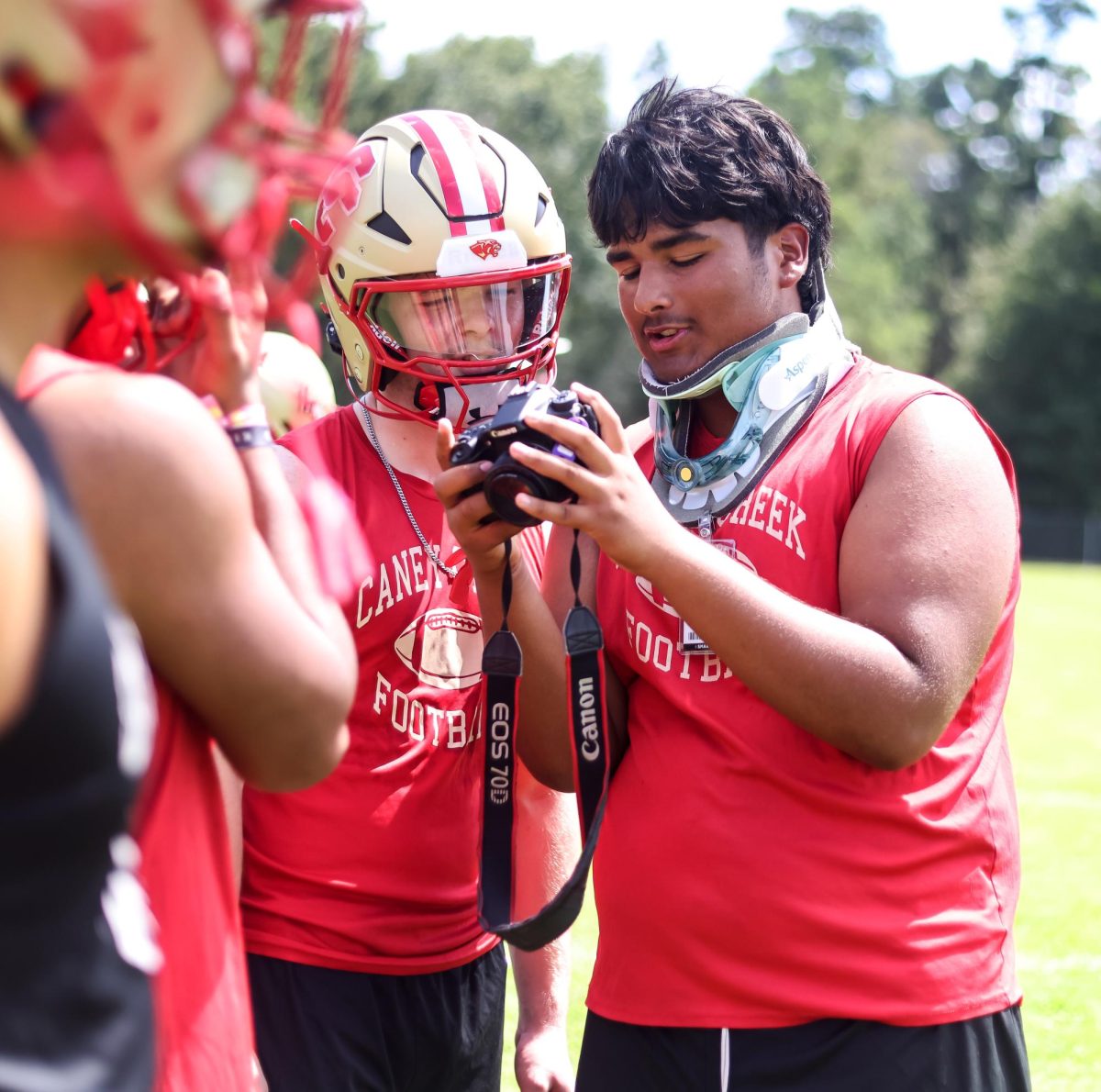 Junior Juan Moreira holds the camera took during football practice on Thursday, Aug. 28. 