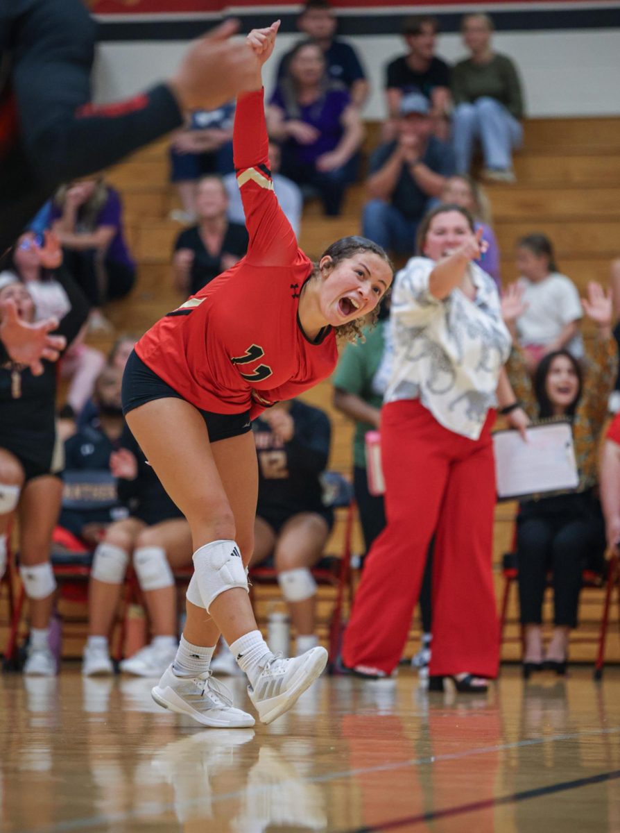 FIRED UP. Junior Zulianette Rivera Lorenzo and her teammates cheer for her team after they make a game winning point against Willis on Aug. 19, 2025.