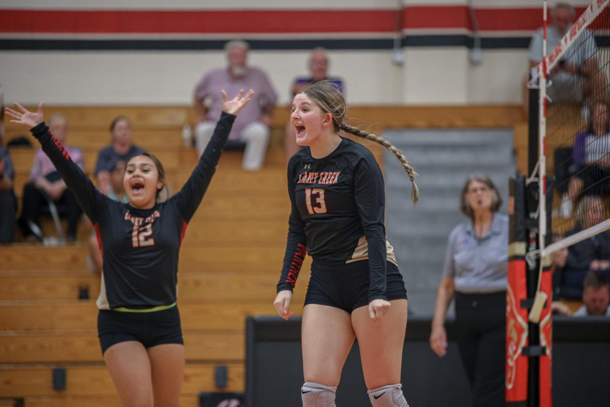 FIERCE CELEBRATION. Junior Kayleigh Herron shouts in excitement after scoring a point during a home game against Willis on Aug. 19, 2025. Herron has been playing for 6 years and is a middle hitter. “ I was super hype in that moment because we were down and I got a really good play.” Herron said. 