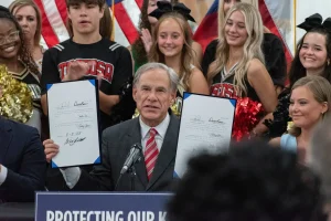 Texas Gov. Greg Abbott holds HB 1481 and SB 2420 during the ceremonial signing Aug. 1. This photo was taken from the Amarillo Tribune website: https://amarillotribune.org/2025/08/01/gov-greg-abbott-visits-amarillo-to-ceremonially-sign-two-bills/ 