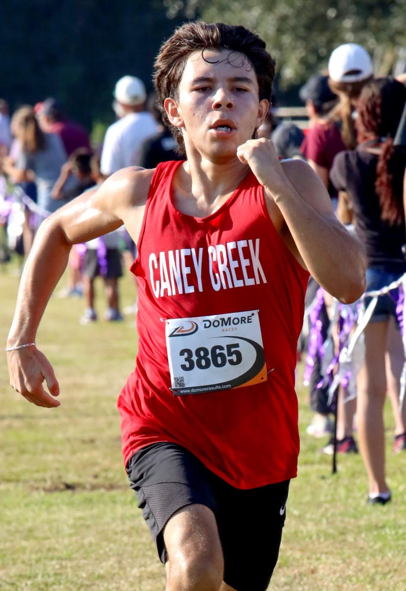 LAST SPRINT. Junior Jesse Harjo blasts forward like a rocket on Sep. 13 at the Dayton Invitational Meet. Harjo would give it his all, bolting forward towards the finish.