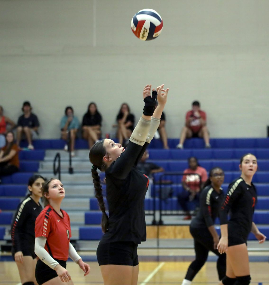 PRECISION. Freshman Lacee Hearn-Dutton jumps for the ball at the Volleyball V. Oak Ridge game on Sept. 19. Dutton was seen hitting multiple serves and blocking spikes all game.