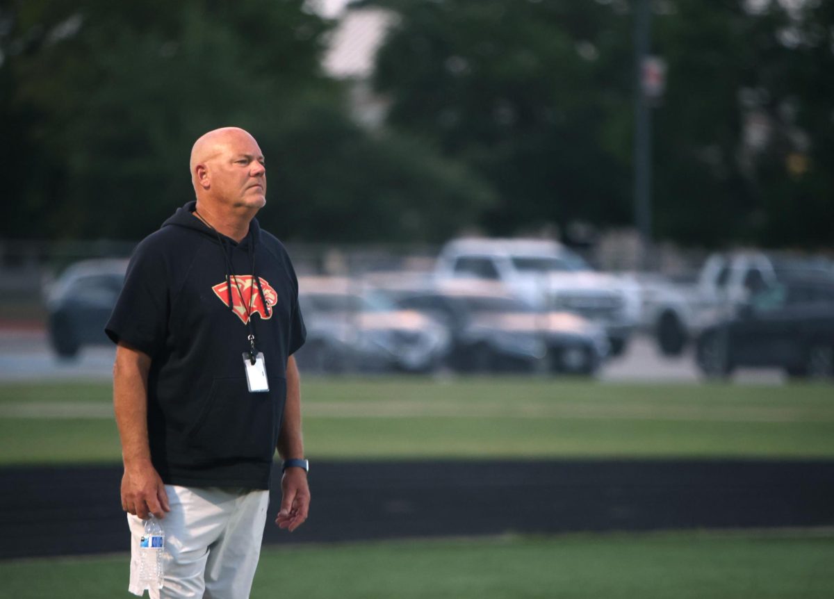 Coach Halloran stands and watches the freshman A game against Waller on Aug. 28, 2025.
