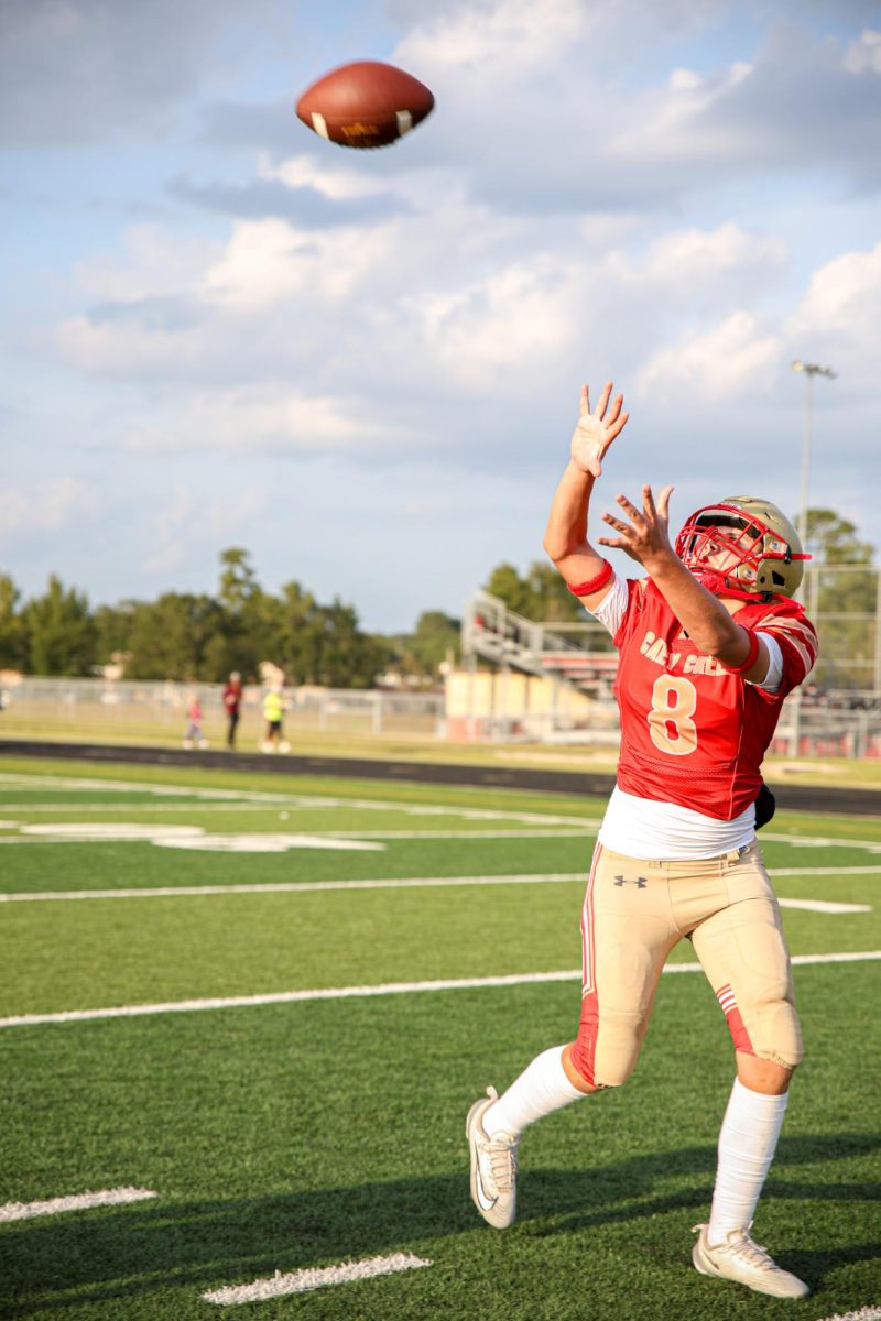 Freshman Chett Smart was catching a ball during their warmups against Waller on Aug. 28, 2025. “Playing my first high school game was good,” Smart said. “I had a lot of high hope that we were gonna win and do good"