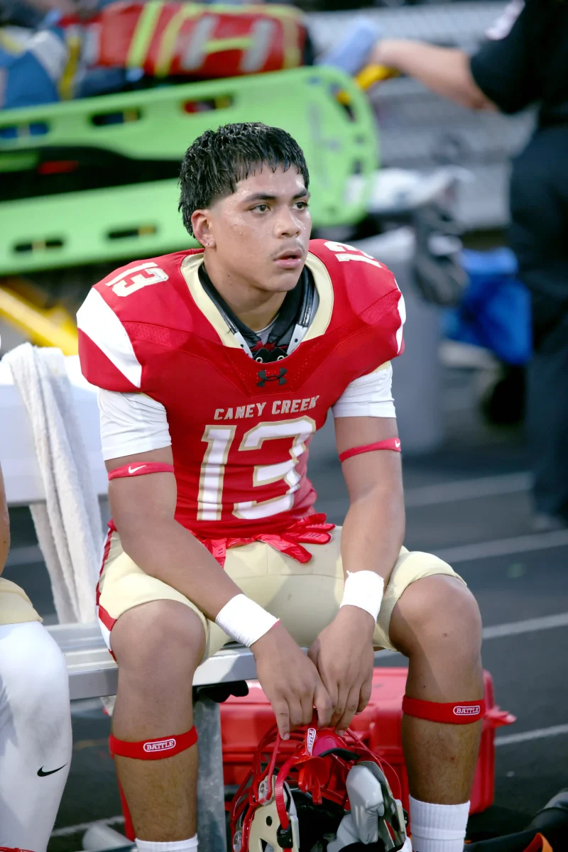 GAME PLAN. Listening to his coach for the plan about the rest of the game, Kristopher Gordillo (11) gets off the field after a tough play. Gordillo had been subbed out briefly to recover after running multiple plays in a row. “I was thinking about the challenge of the game, figuring out how to come back on 41defense even stronger,” Gordillo said.