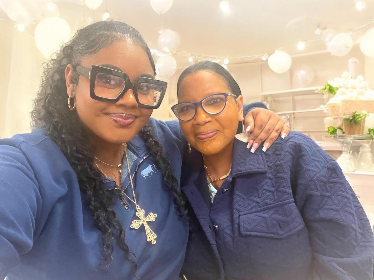 Junior Alei Harris and life skills paraprofessional Lillian Robinson pose together in a selfie.