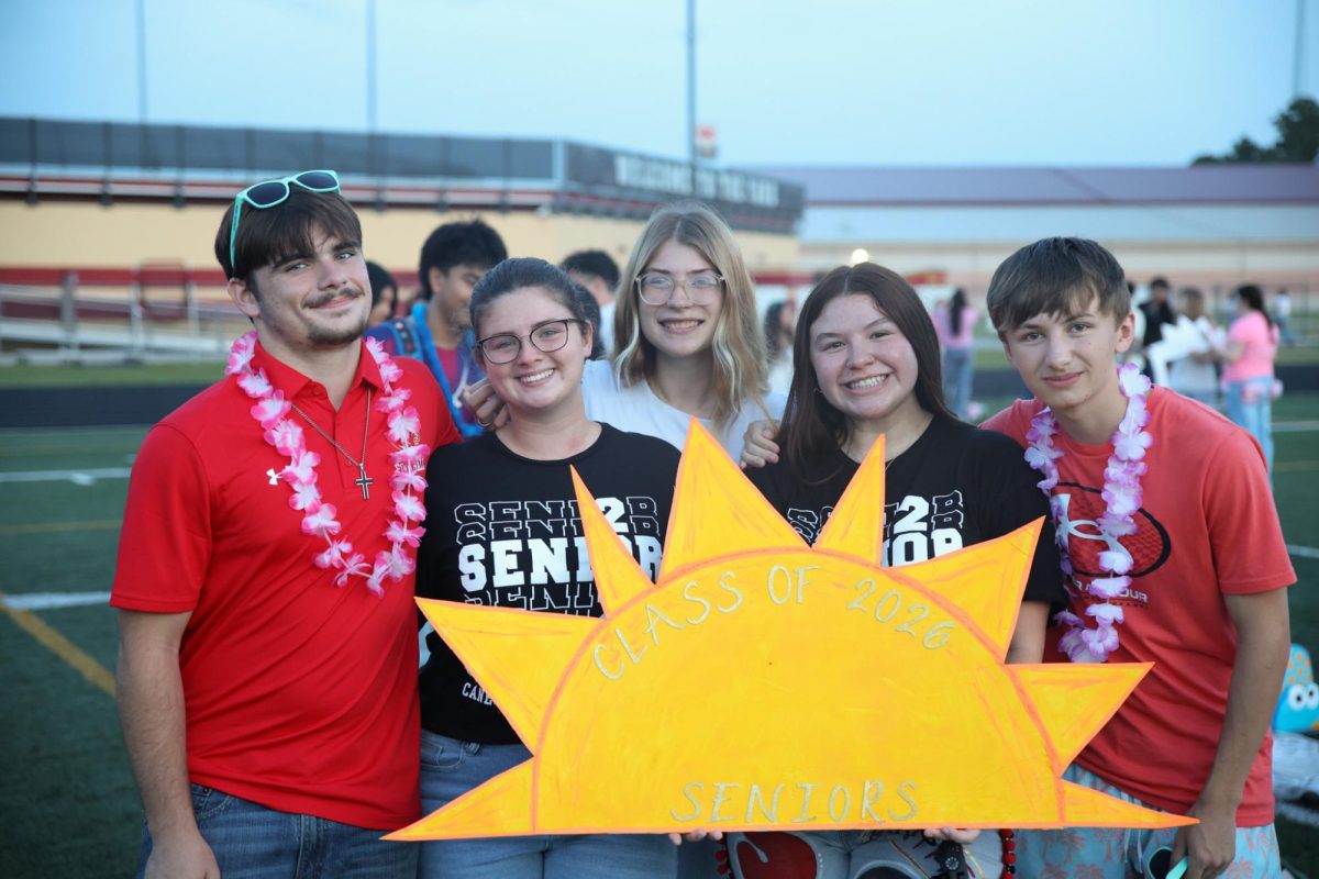 Seniors Devin Hodges, Kalli Jordan, Jordan Stone, Mayah Roop , Jackson Weddle all take a photo together at the Senior Sunrise on Aug. 29, 2025. 