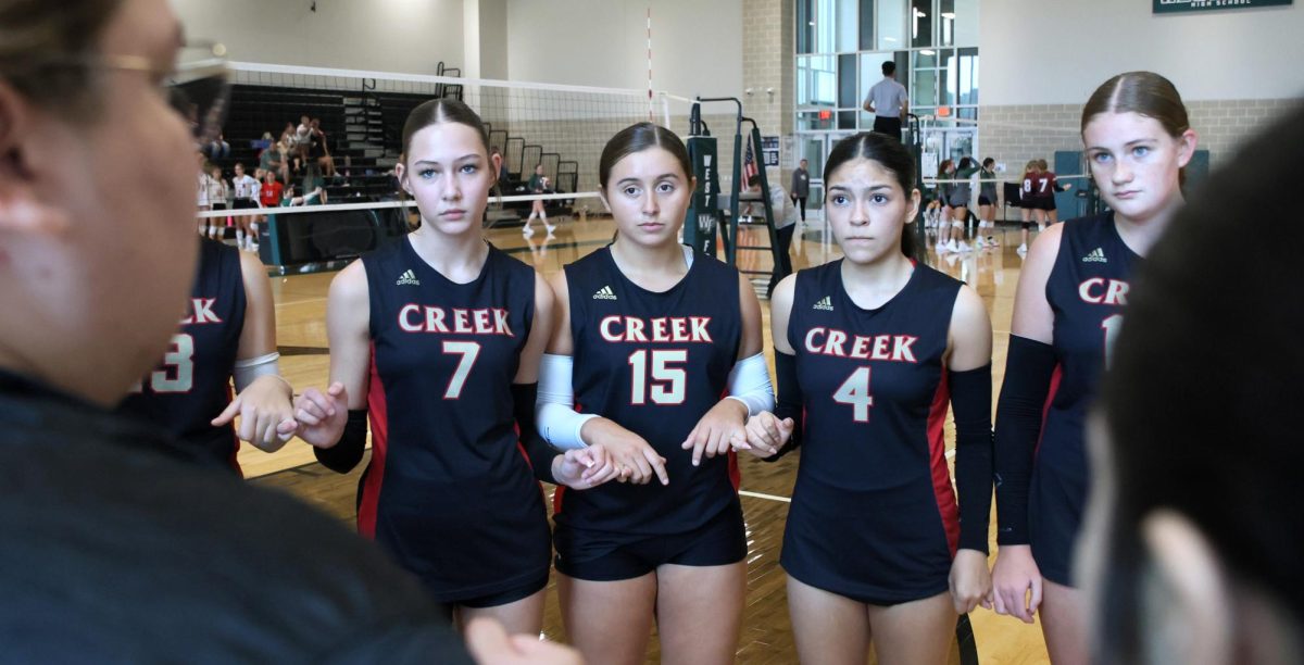CONFIDENCE BOOST. Coach Mitchle, a Caney Creek JV Volleyball coach was pep-talking her team and walked them through  how she wanted them to play the rest of the match out, making sure they all understood what to do. Mitchell’s main purpose was to have the team keep their confidence up.