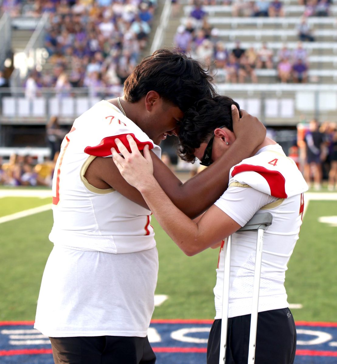 PRAYER. Junior Juan Moreira Portillo stands there with Senior Carson Gauvreau and prays before the game on Sept. 12, 2025. They pray for not only their team's safety, but for their opponents too. “We pray about having strength and pray for our team,” Moreira said. “ We give thanks for being able to be there for what we love to do, and give all thanks to God.”