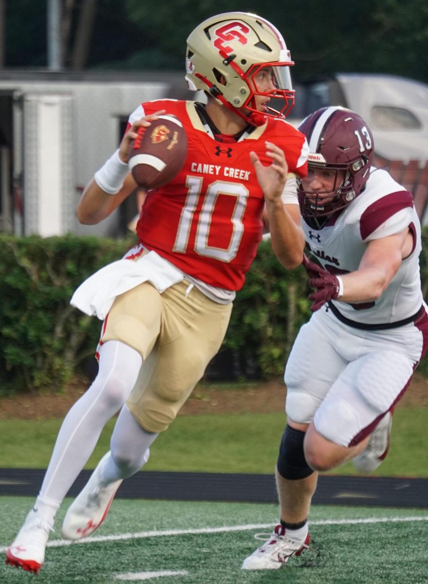 CONFIDENT. During the game VS Waller on Friday, Aug. 29, Kaleb Marshall (11) passes and scans for his teammates. Kaleb was later seen getting the pass complete. “I was very confident on my reserver cause it was Amarin and we have a good connection with each other,” Marshall said.