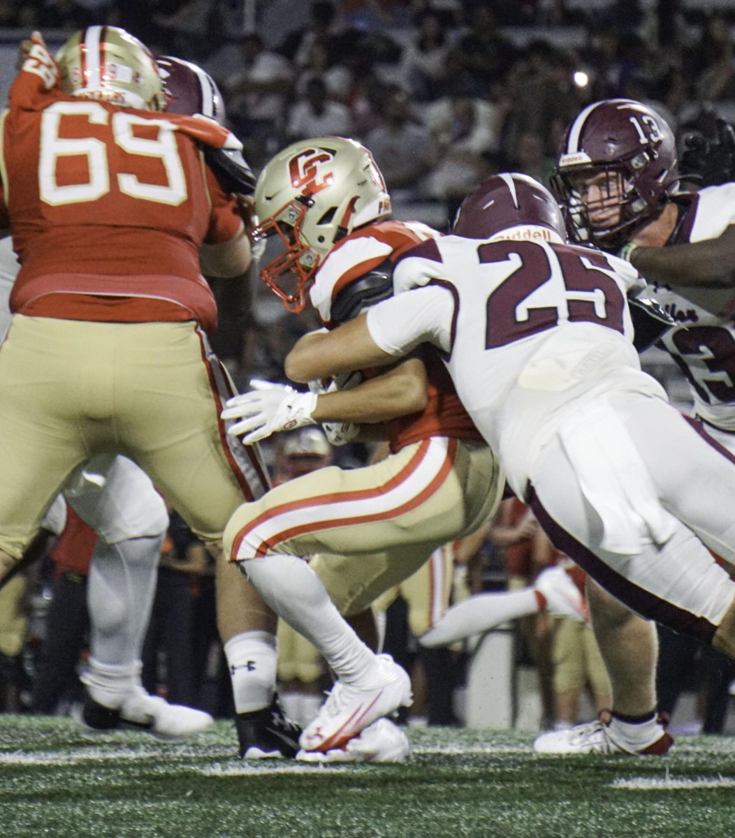 WARPED. As the game progresses Arron William  (10) runs with the ball towards the half waymark while marked  pushing through against Waller on, Aug.29. Arron says “Keeps his feet firm like his coached told him”