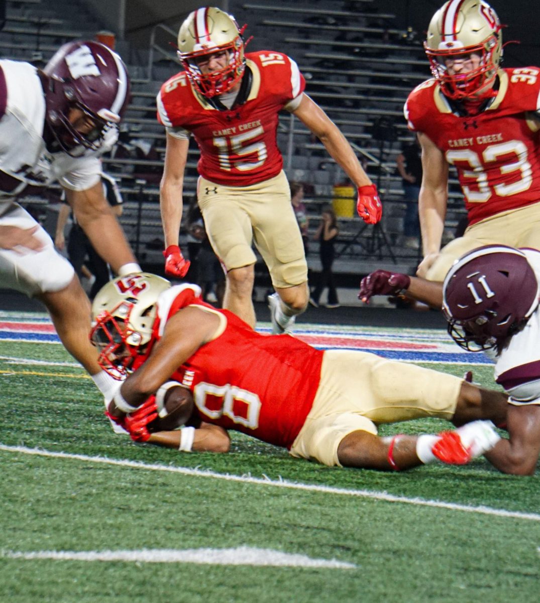 RECOVER. As quarterback from Waller fumbles the ball player Elian Gaona (11) recovers the ball and gets possession of the football. “As the play was playing around the quarterback runs out and I see the ball pop out and I say I got to go get that  I have to get the ball I run to the ball I dive and I’m struggling to keep the ball,” Goana said.