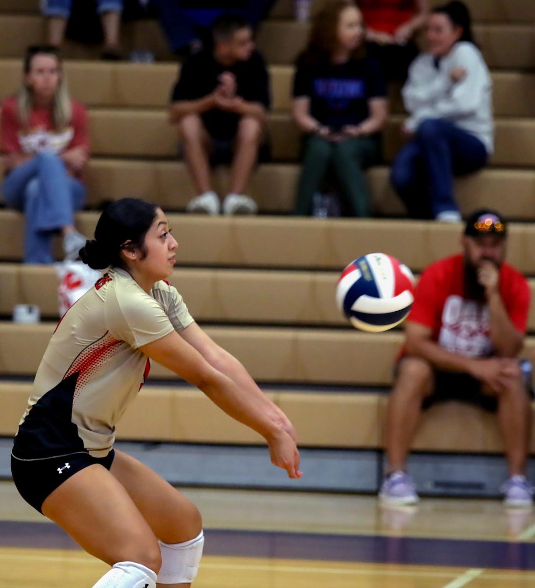 FIRST TOUCH. Junior Carolina Caudillo goes on defense and bumps the ball at the Volleyball V. Oak Ridge game on Sept. 19. Caudillo continued throughout the game on defense to support her team.
