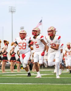 GAME TIME. Senior Isaiah Rivera and his teammates running out on the field to the fight song on Sept 12, 2025. “I was excited to go play with my brothers,” Rivera said. “Just an exciting opportunity to go try my best.”