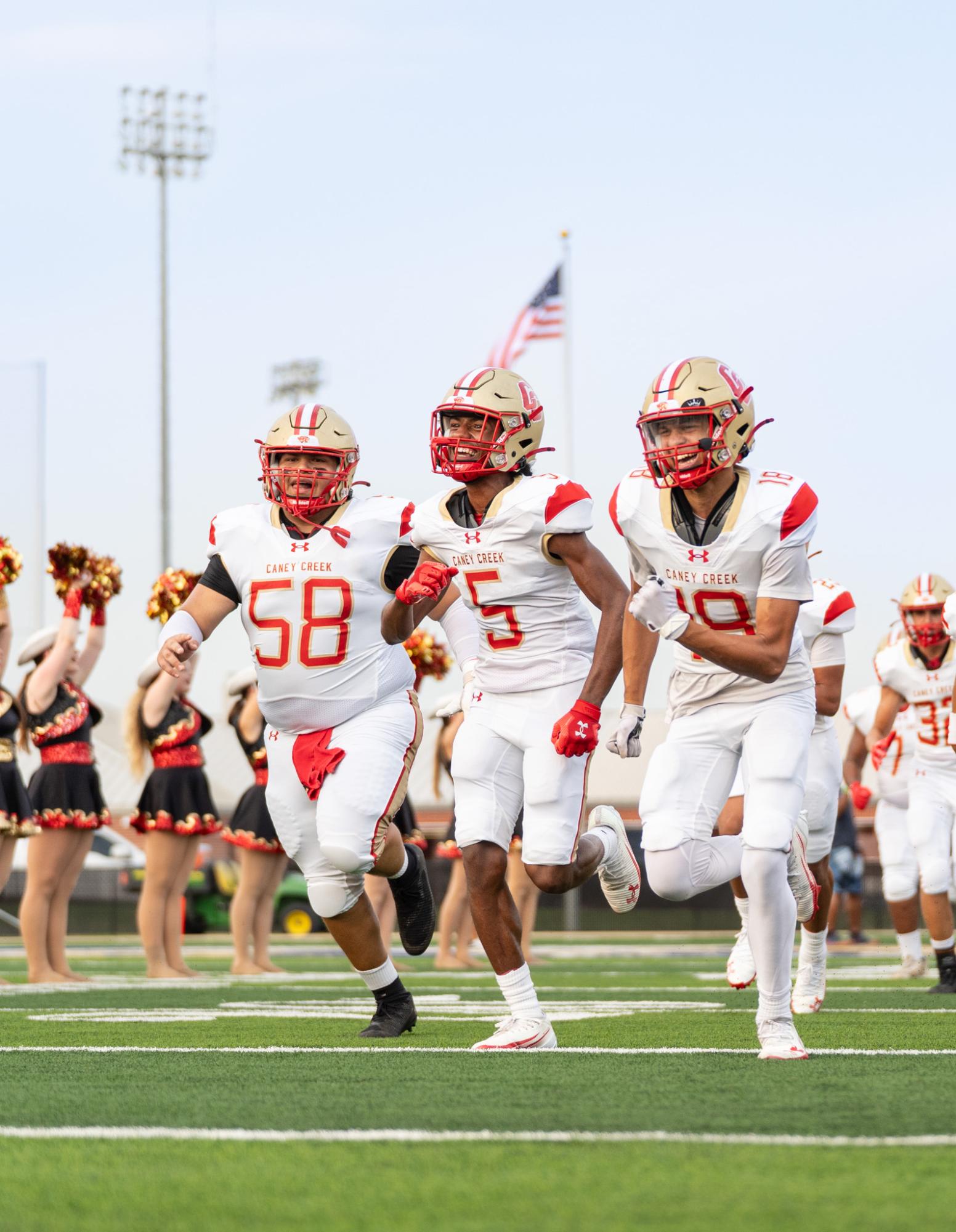 GAME TIME. Senior Isaiah Rivera and his teammates running out on the field to the fight song on Sept 12, 2025. “I was excited to go play with my brothers,” Rivera said. “Just an exciting opportunity to go try my best.”
