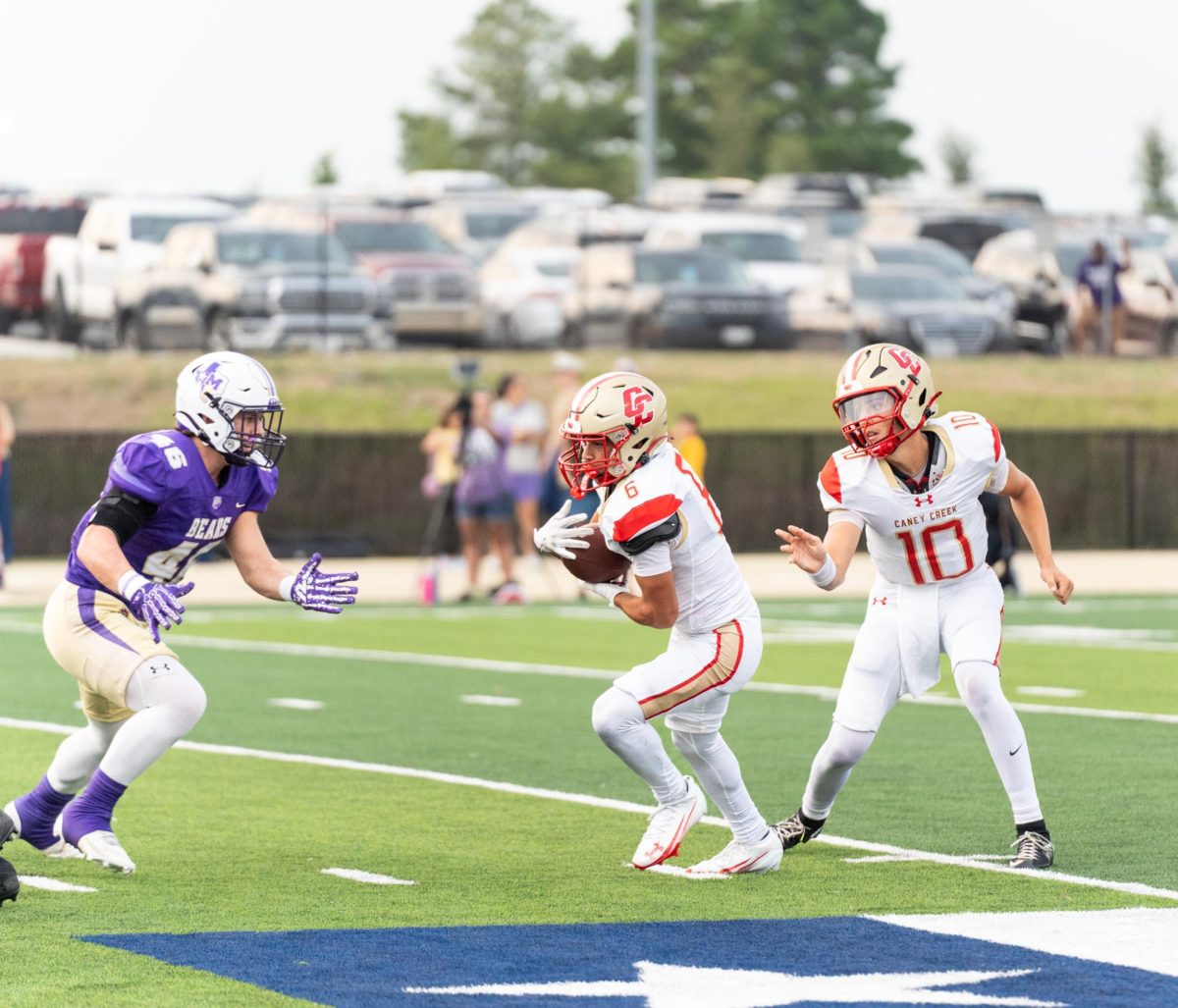 THE DRIVE. Sophomore Aaron Williams wrapped his arms around the ball and glanced for the first down on Sept 12, 2025. “I got the ball and I'm looking around trying to find the best hole to hit and I ran hard and tried to find one but got tackled,” Williams said. “Our team just needs to find its connection.”