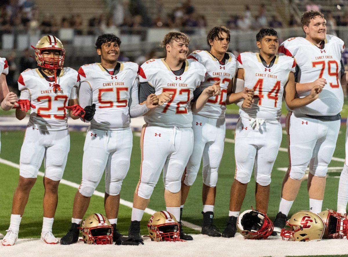 TRADITION. Senior Jhorany Cornejo and Jayson Yates swayed back and forth enjoying the moment to the school song. The seniors take a moment to soak in the tradition and spirit of the school's song.